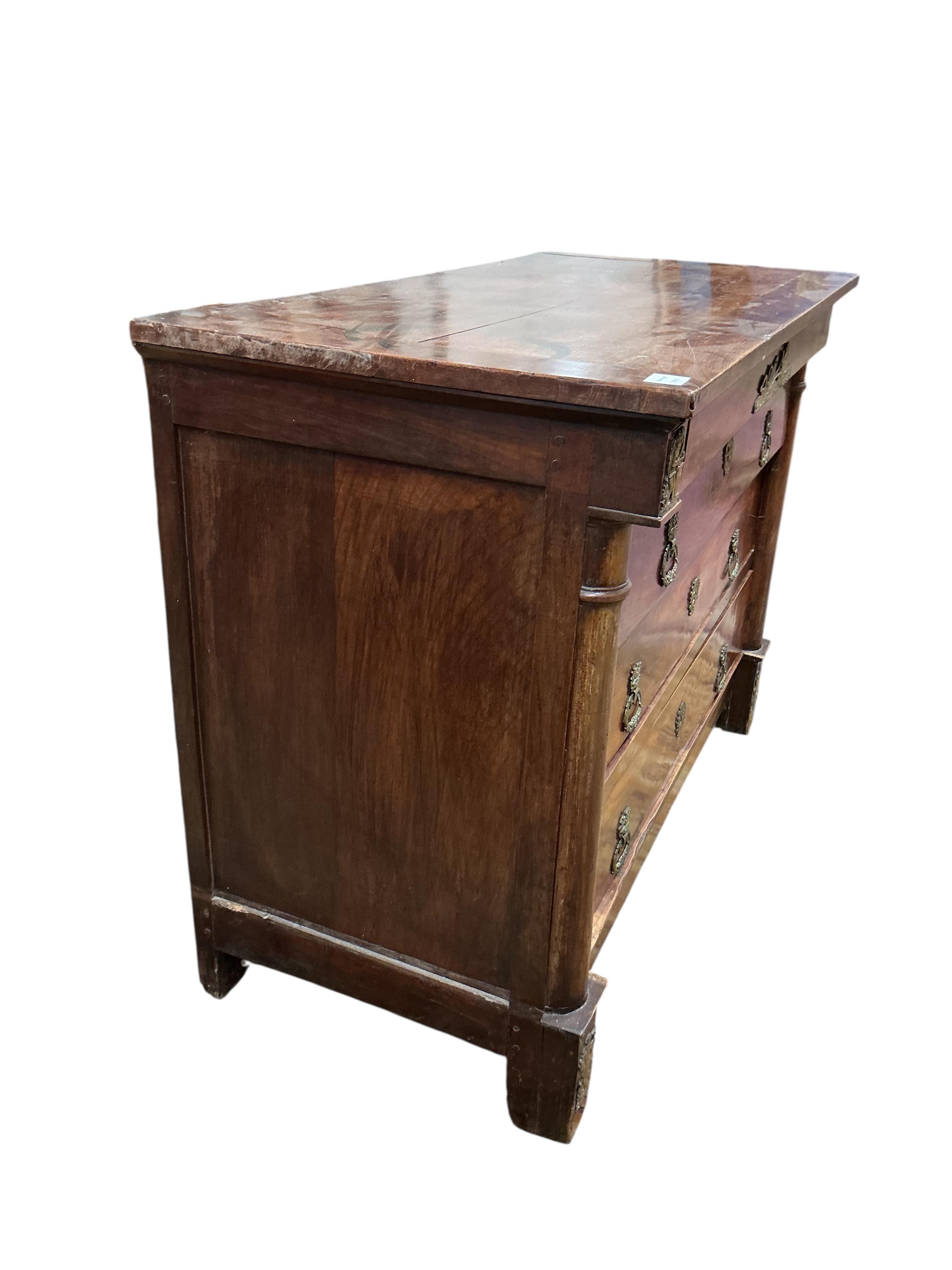An early 19th century French ormolu mounted cherry commode, fitted four long drawers, width 117cm, depth 56cm, height 87cm